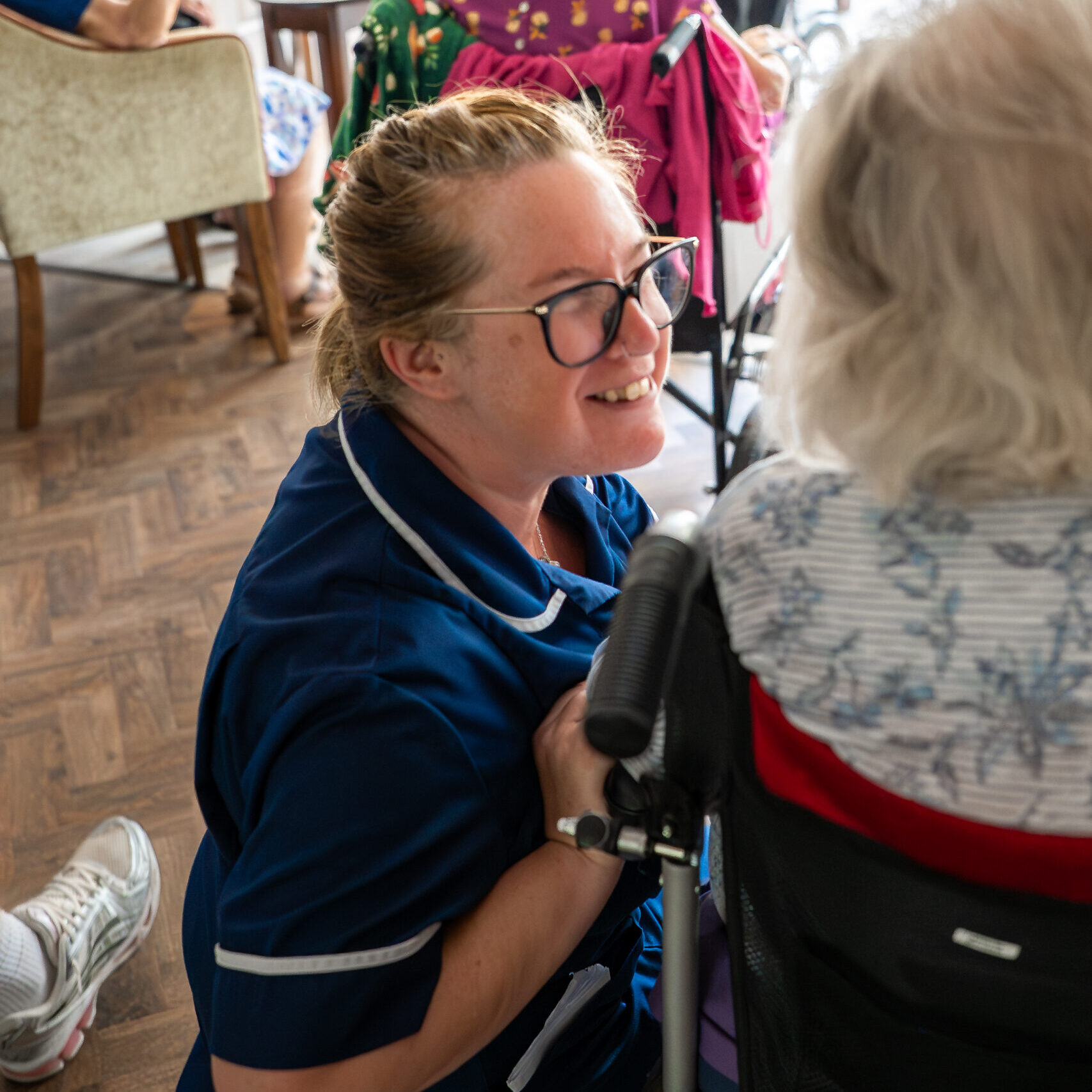 Carer chatting with a resident at Tudor Lodge