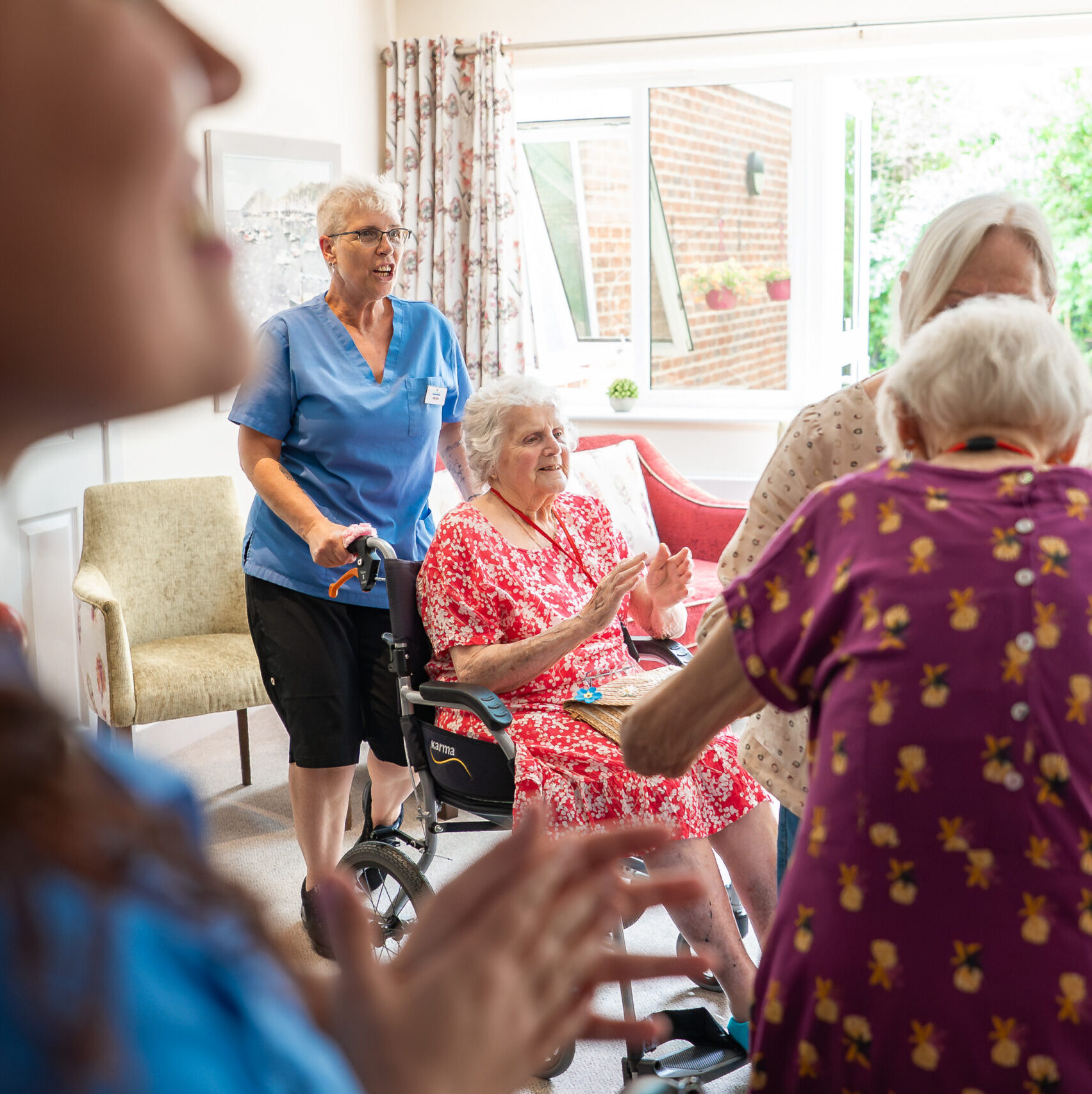 Carers and residents enjoying an activity session together at Tudor Lodge