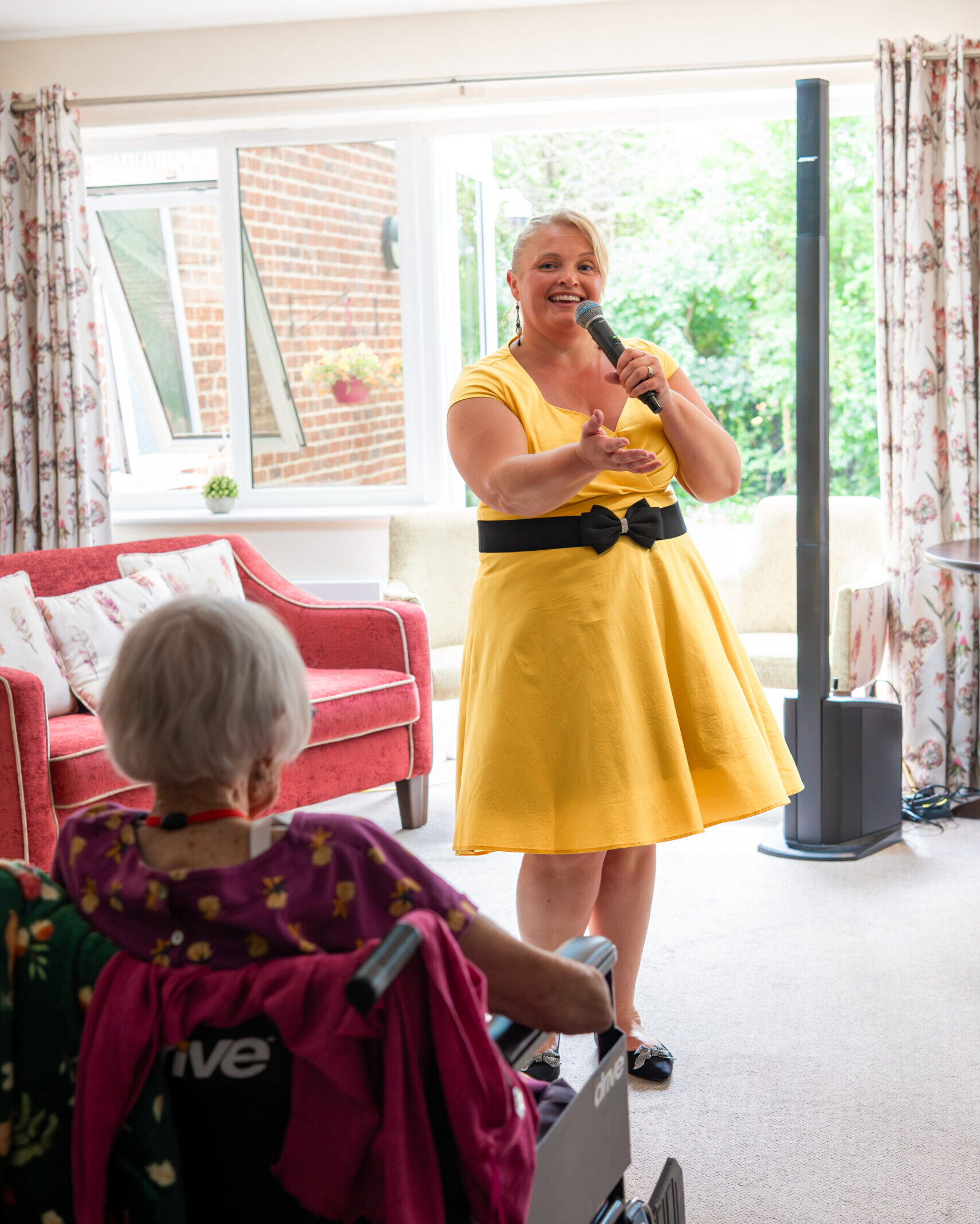 Live music performance for residents in the lounge at Tudor Lodge